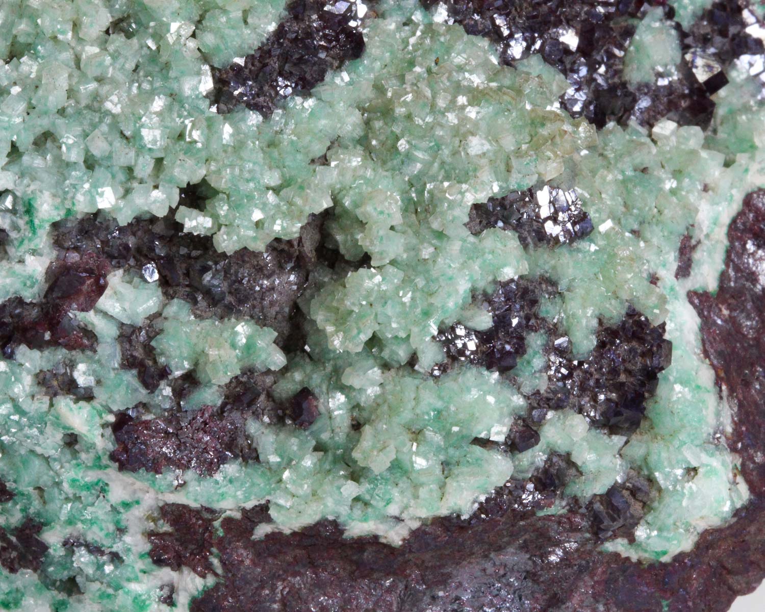 Calcite on Cuprite with Malachite inclusions