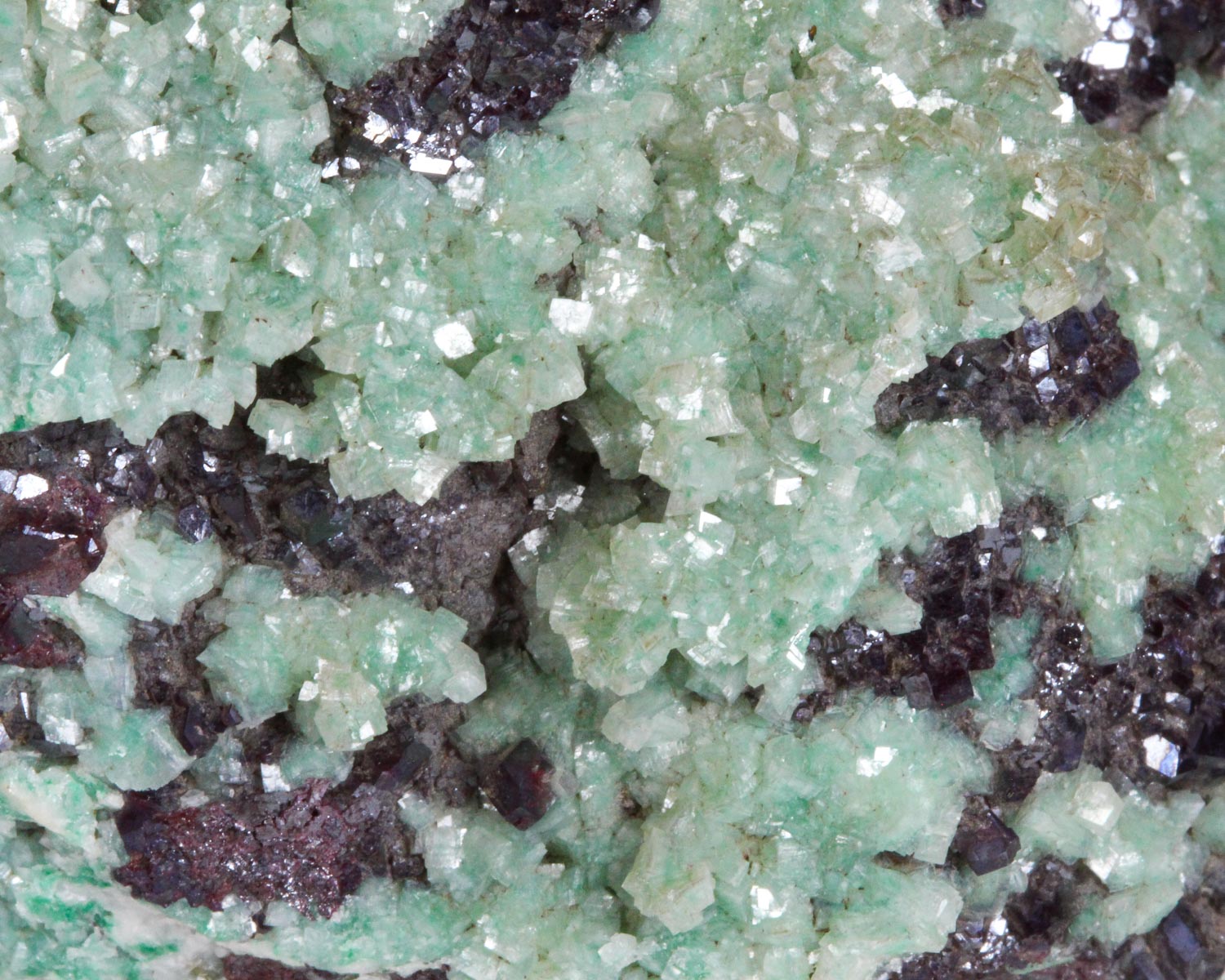 Calcite on Cuprite with Malachite inclusions