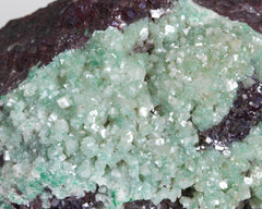 Calcite on Cuprite with Malachite inclusions