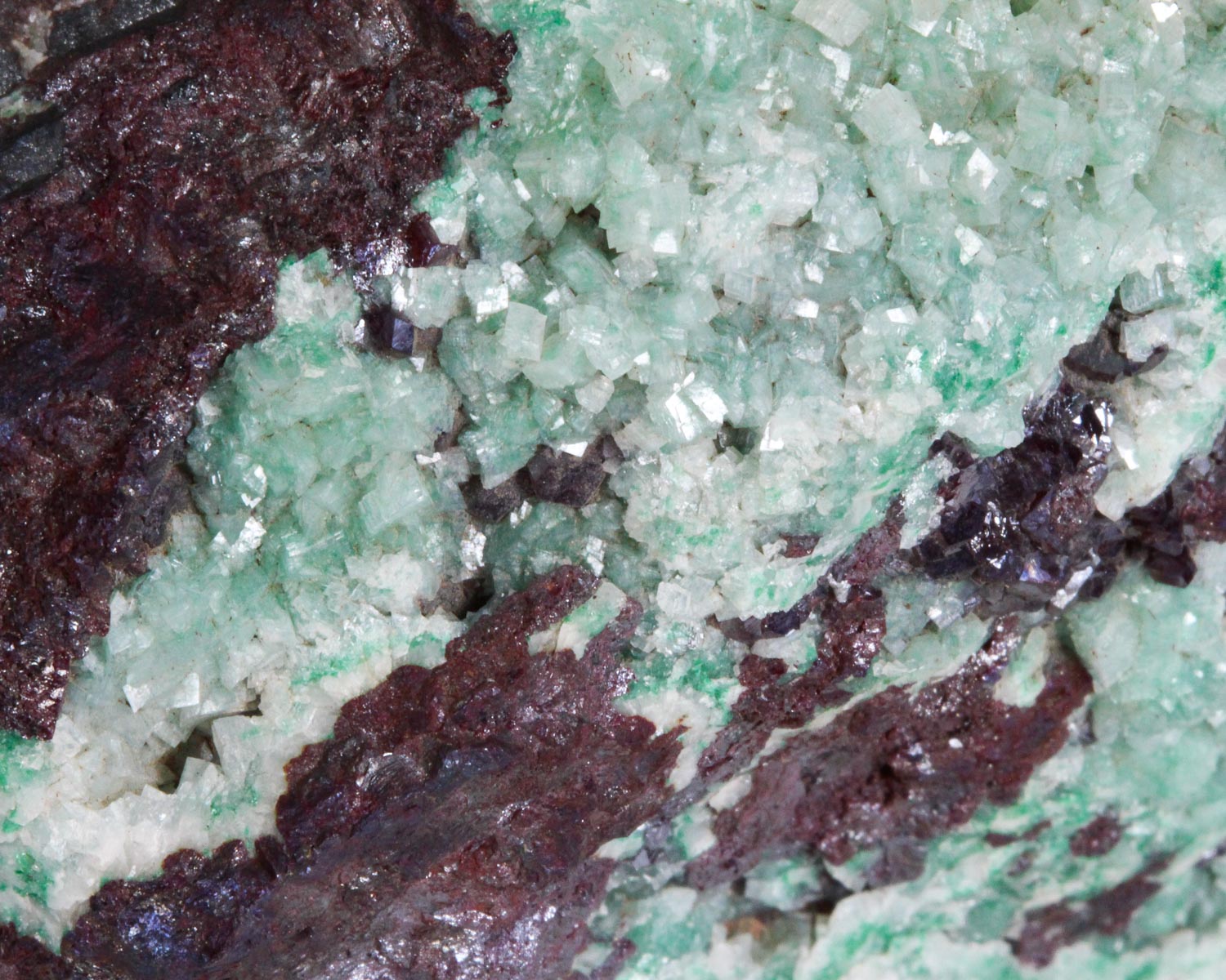 Calcite on Cuprite with Malachite inclusions